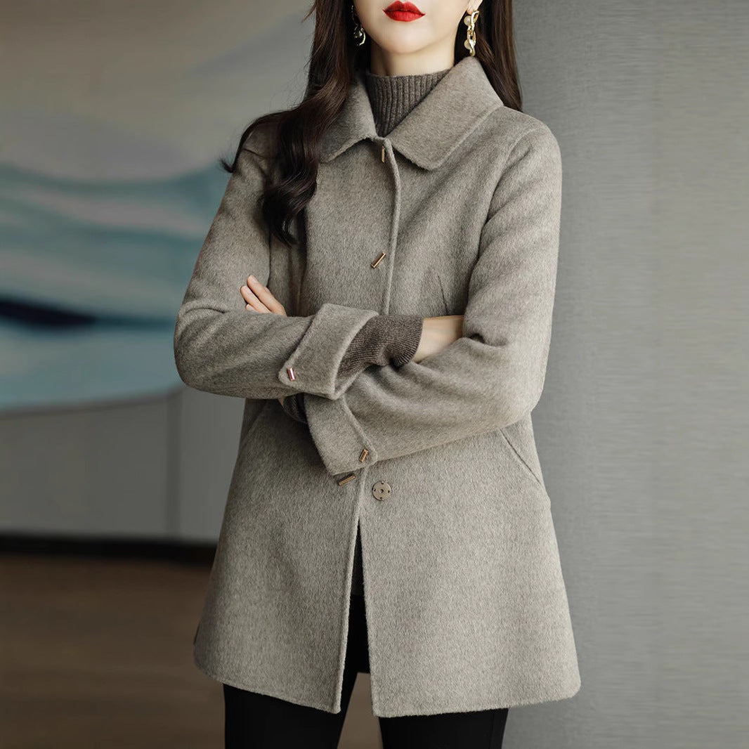 A woman wearing a woolen coat
