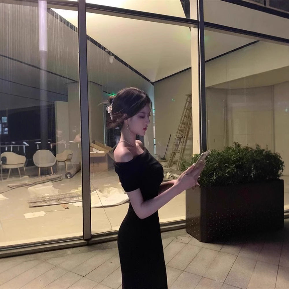 A woman in a one-shoulder dress