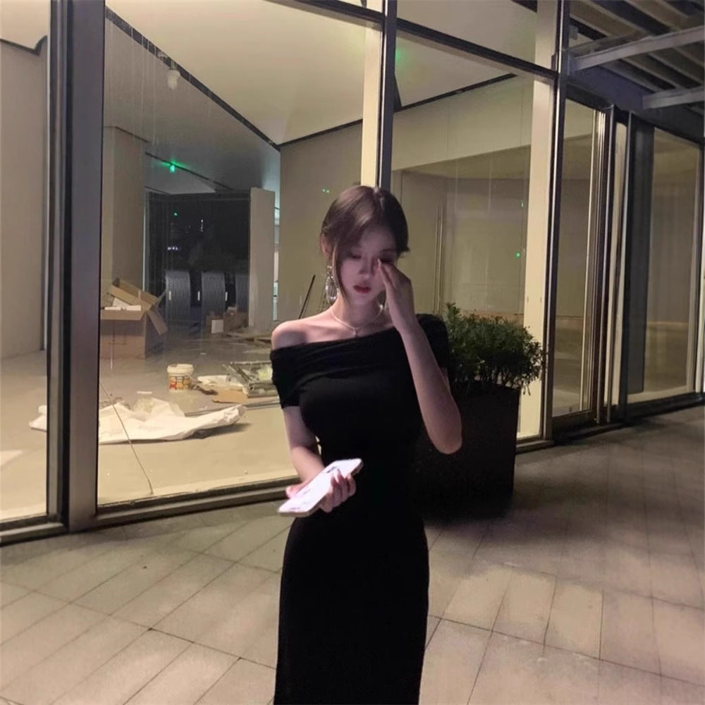 A woman in a one-shoulder dress
