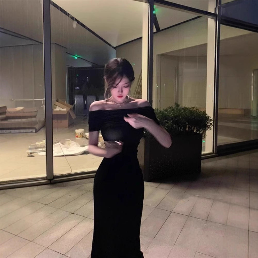 A woman in a one-shoulder dress