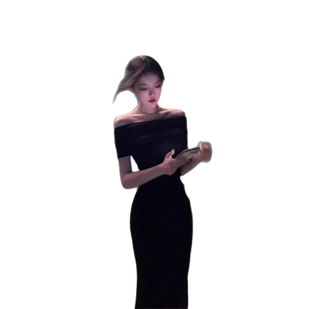 A woman in a one-shoulder dress