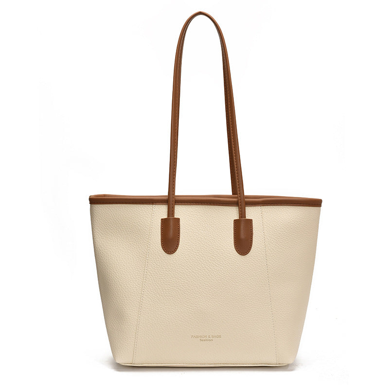 Single-shoulder bag with an oversized compartment under the arm