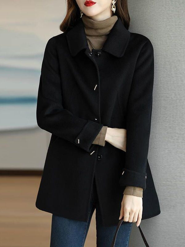 A woman wearing a woolen coat